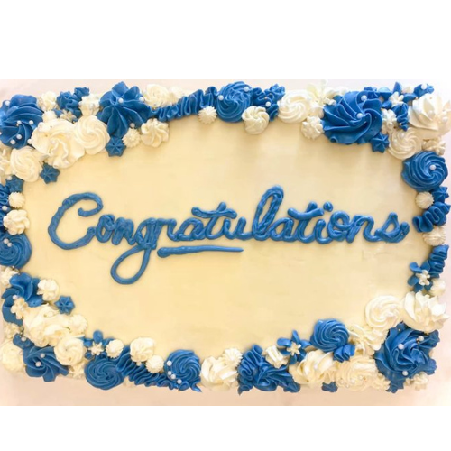 2 pounds congratulations cake with white frosting and blue floral decorations
