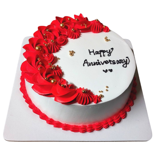 Anniversary cake with red floral cream swirls, golden pearls, and Happy Anniversary message.