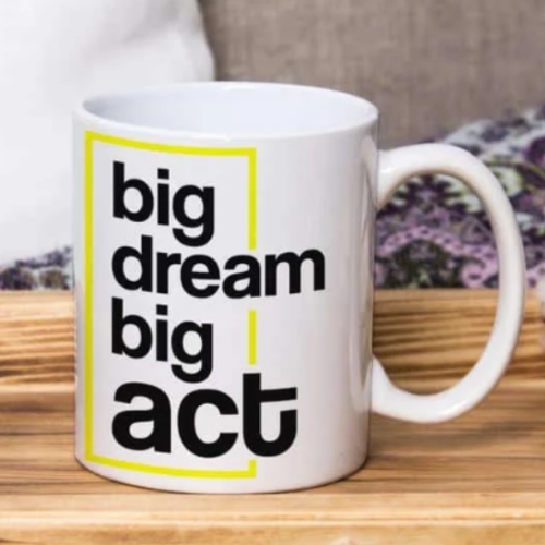 White ceramic mug with “Big Dream Big Act” printed in bold typography