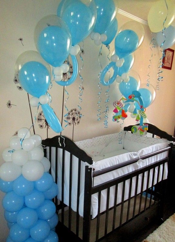 Blue and white baby boy crib balloon decoration setup for baby shower