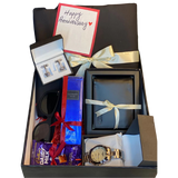 Classic men’s gift box with shalwar kameez, chain watch, perfume, cufflinks, wallet, sunglasses, chocolate, and handwritten card