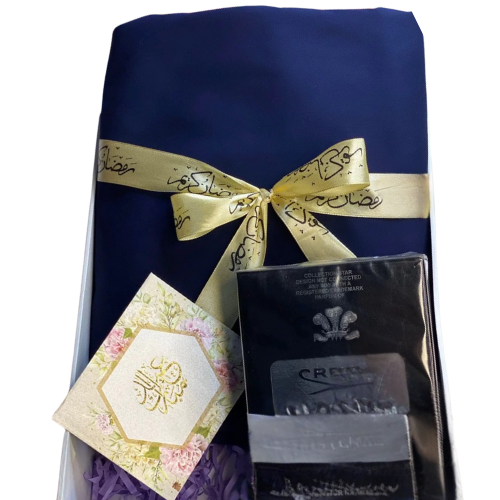 Elegant Eid gift box with unstitched cotton suit, chain watch, and greeting card