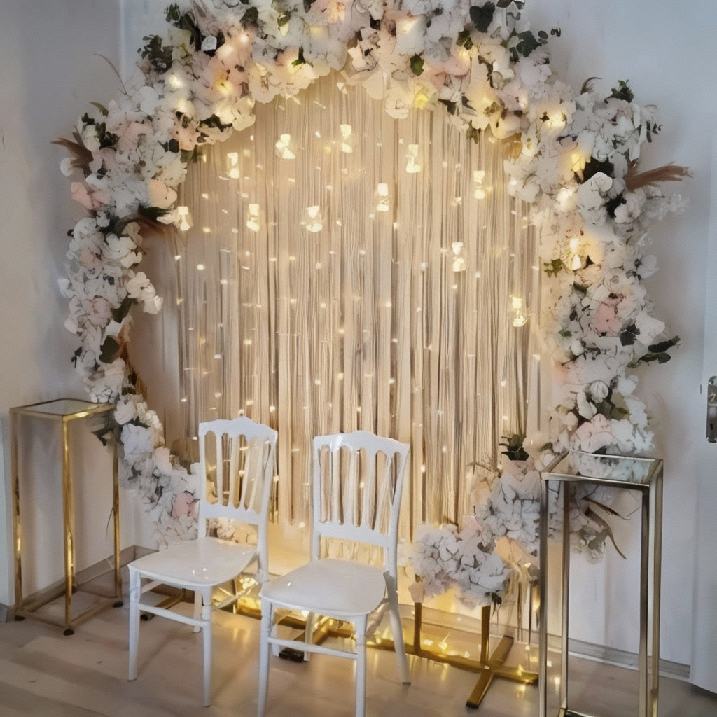 A beautiful floral arch with red, white, and pink flowers surrounding a white sofa, with the words "Better Together" in the background.