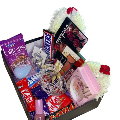 Elegant sister gift box with chocolates, Huda Beauty palette, blush kit, nail polish, lipstick, bangles, everlasting rose, and festive gajray.