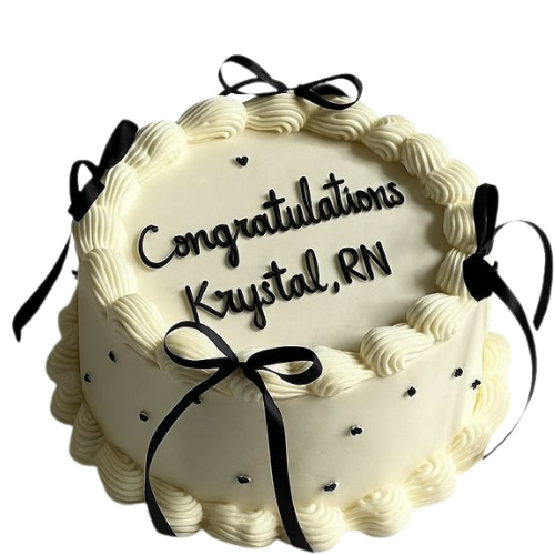 Elegant white congratulations cake with black ribbons and cream piping design