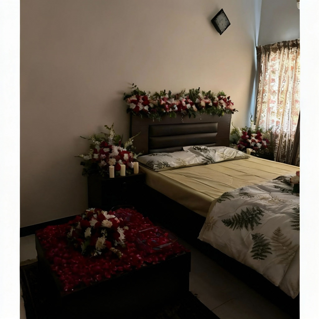 Enchanted Bloom Canopy Bed Decor with red and white flowers, green foliage, white drapes, string lights, and rose petals.