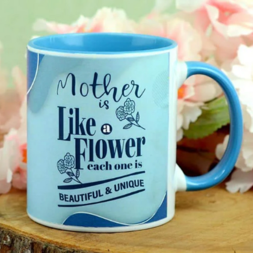 Blue ceramic mug with floral quote: “Mother is like a flower, beautiful & unique”