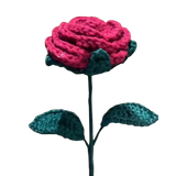 Handmade crochet red rose with green leaves on a long yarn stem.
