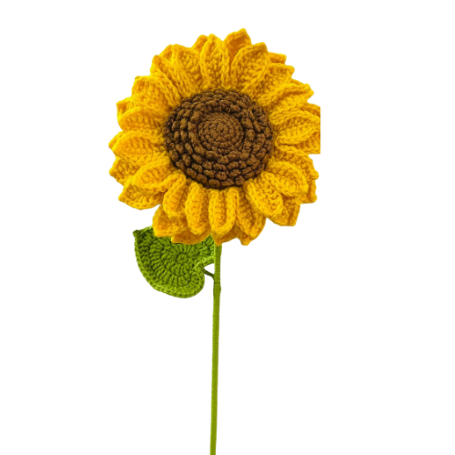Handmade crochet sunflower with yellow petals, brown center, and green leaf on a stem.