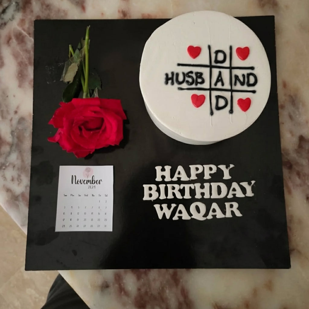 Birthday cake with tic-tac-toe heart design, "HUSBAND" text, red rose, and November calendar - celebrating a special loved one's birthday