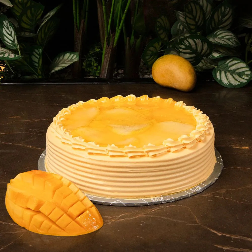 "Jlal Sons Classic Mango Cake with fresh mango cream and topping, available for delivery in Lahore, Karachi, and Islamabad"
