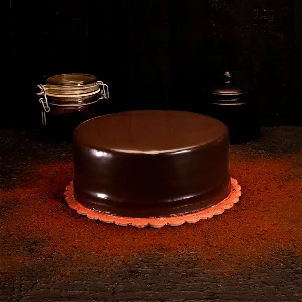 "Jlal Sons Classic Taiwan Chocolate Cake with glossy chocolate glaze, available in Lahore, Karachi, and Islamabad"
