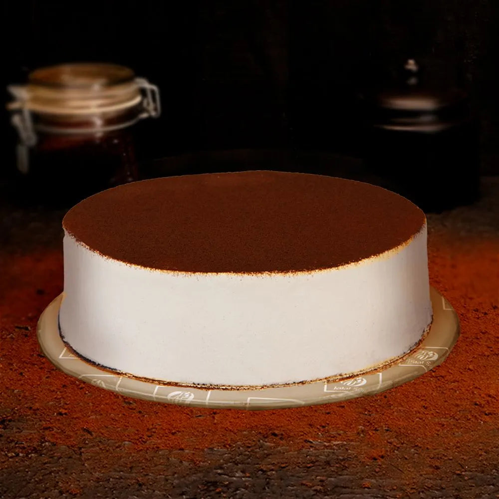 "Jlal Sons JS Tiramisu Mousse Cake topped with cocoa powder, available for delivery in Lahore, Karachi, and Islamabad"