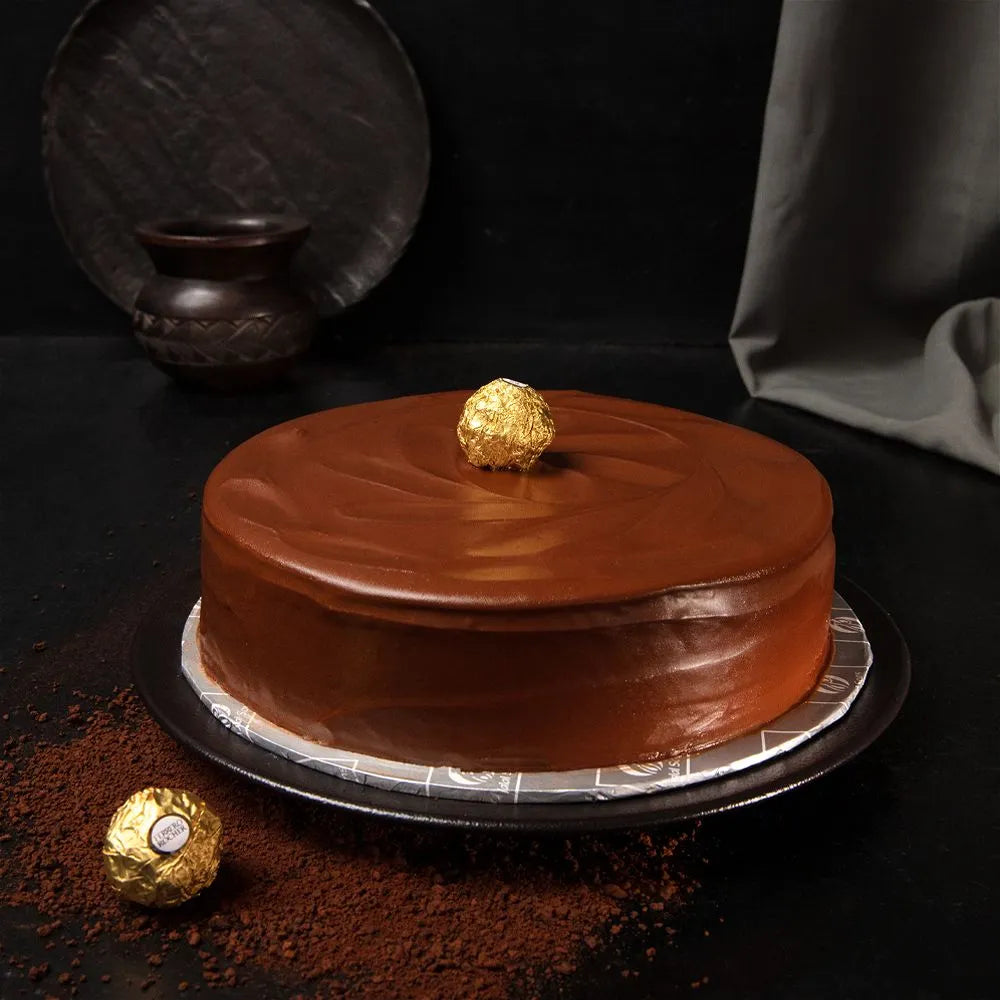 "Jlal Sons Royal Ferrero Rocher Cake topped with Ferrero Rocher chocolate, available in Lahore, Karachi, and Islamabad"