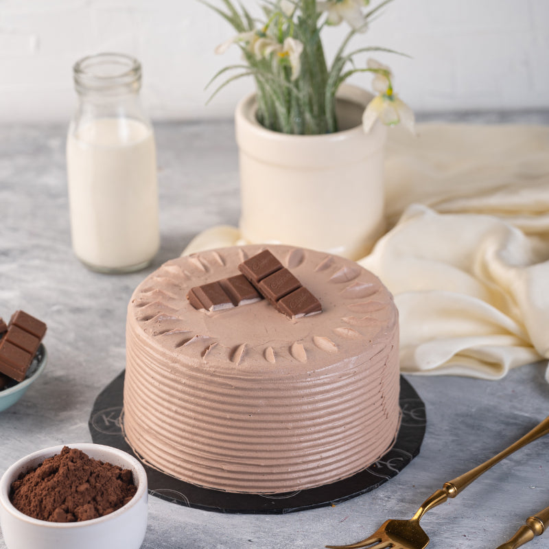 "Kitchen Cuisine Cadbury Chocolate Cake with Cadbury chocolate cream and topping, available in Lahore, Karachi, and Islamabad"