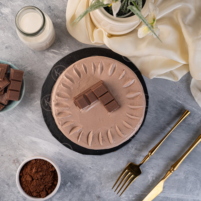 "Kitchen Cuisine Cadbury Chocolate Cake with Cadbury chocolate cream and topping, available in Lahore, Karachi, and Islamabad"
