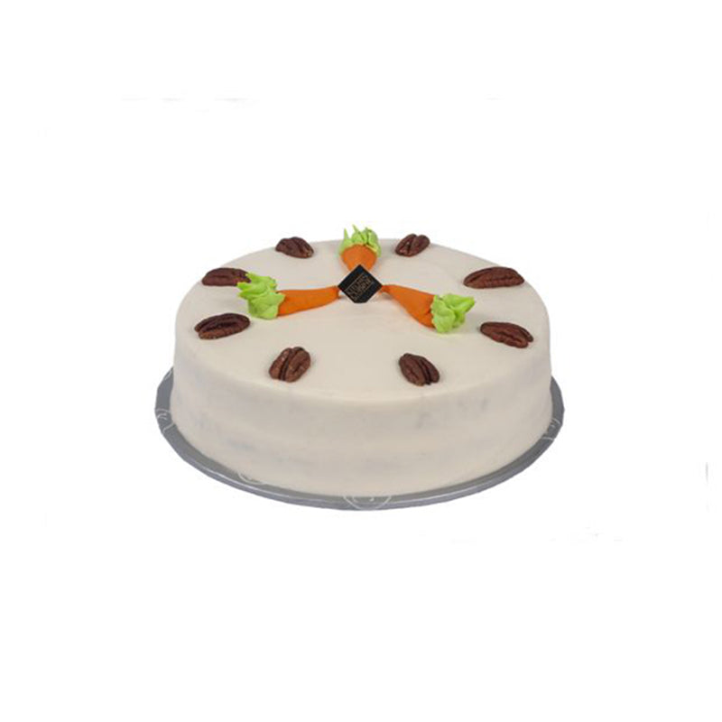 "Kitchen Cuisine Carrot Cake with cream cheese frosting, walnuts, and carrot decorations, available in Lahore, Karachi, and Islamabad"