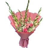 Large hand-tied bouquet with soft white gladiolus, pink and cream roses, and baby's breath wrapped in pink paper – perfect for Mother's Day and elegant gifting in Pakistan