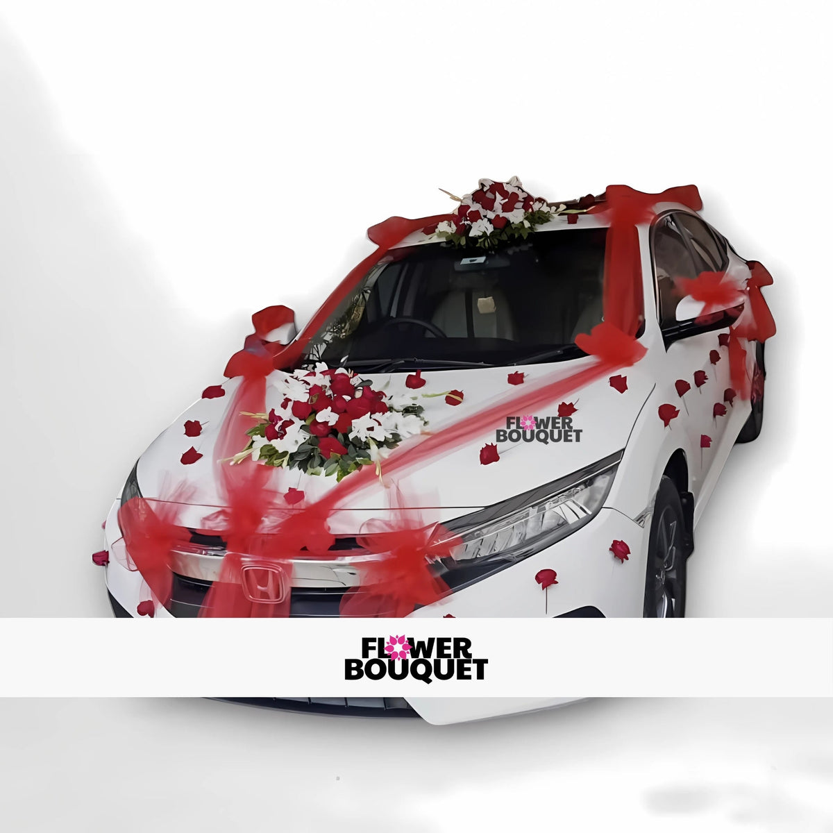White Honda car decorated with red and white flowers and red ribbons.