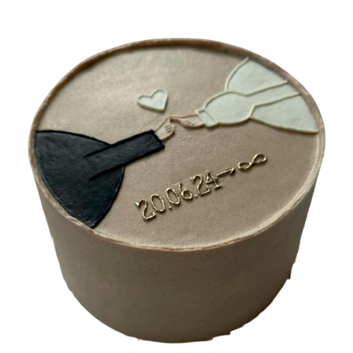 Minimal engagement cake with bride and groom hand design, heart, and personalized date detail.