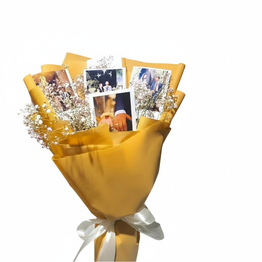 A beautifully wrapped golden bouquet featuring delicate baby's breath flowers and personalized photo prints, perfect for weddings, anniversaries, or heartfelt gifts.