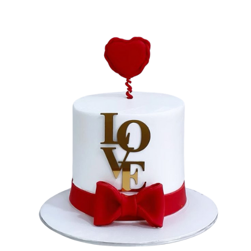 Pure Love Cake with red bow, golden LOVE topper, and heart decoration