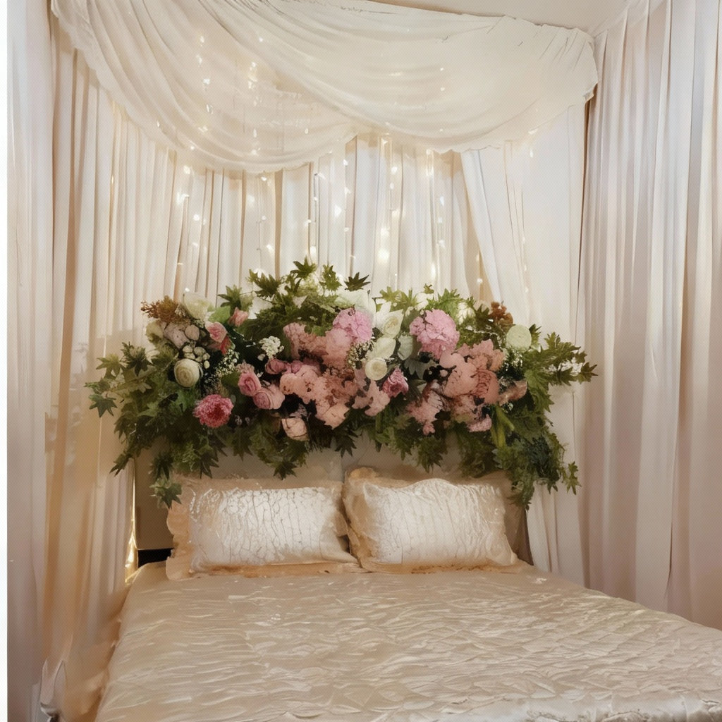 Romantic Garden Canopy Bed Decor with red and white flowers, green foliage, white drapes, and cream bedspread.