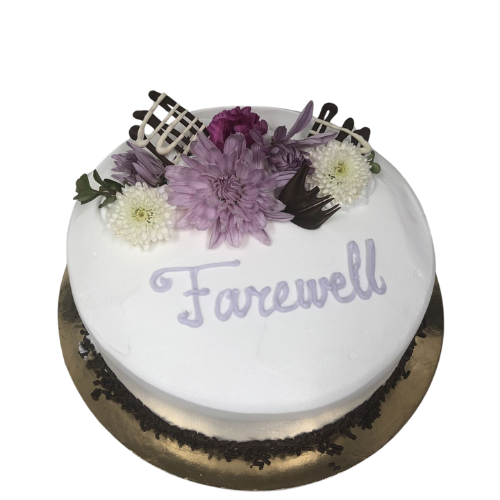 "Round farewell cake with purple and white floral decoration and Farewell message on top."