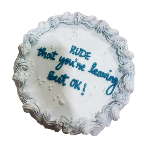 "Round farewell cake with white icing, blue piping, and a humorous farewell message written on top."