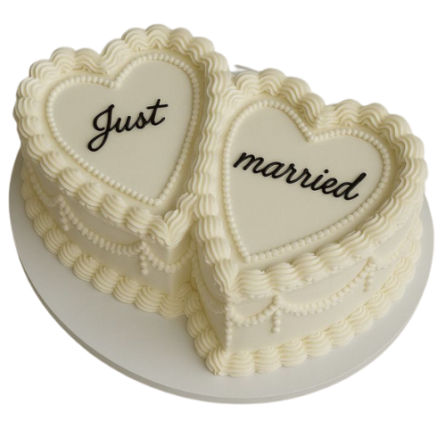 Twin heart-shaped white wedding cake with “Just Married” message in black icing