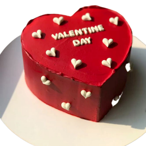 Valentine Heart Cake with red frosting, white hearts, and Valentine’s Day text