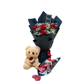 red roses bouquet with baby’s breath in black and white butterfly wrapping
